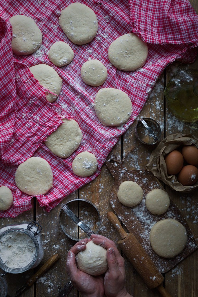 Rustic scene in bread making and hands in frame
