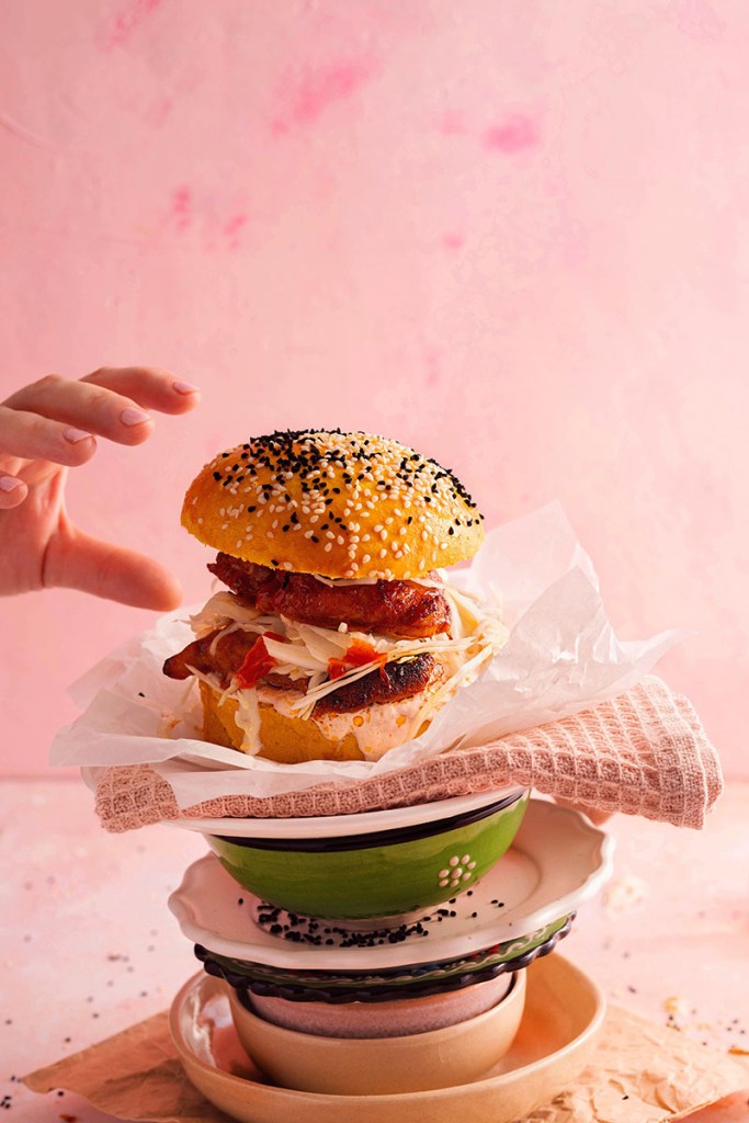 Chicken burger with salad in a homemade burger bun.