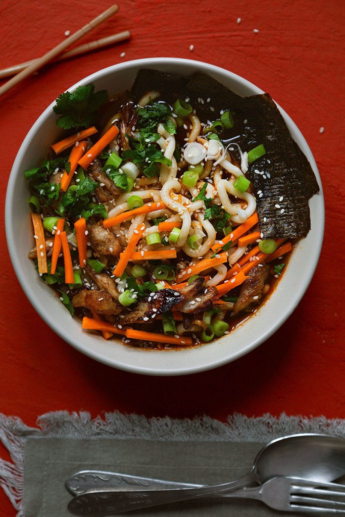 Ramen, noodle, bowl with seaweed, carrots, corriander, spring onions.