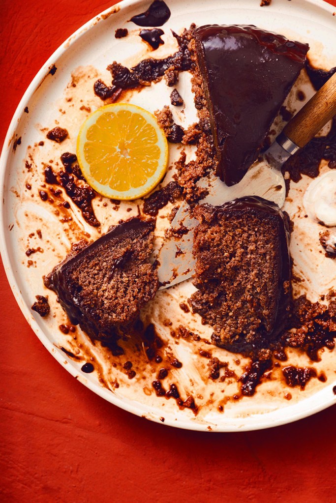 Leftover three slices of the moist  chocolate and orange cake on cake plate.