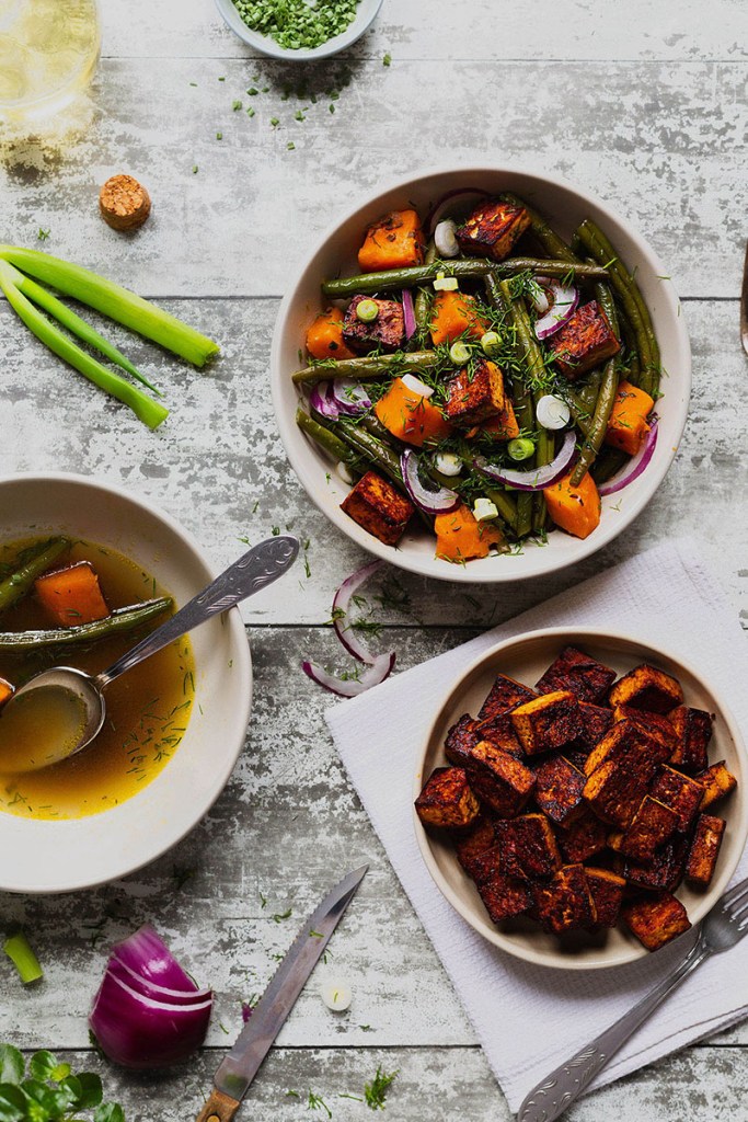 French beans and sweet potato stew with fried tofu pieces on the side.