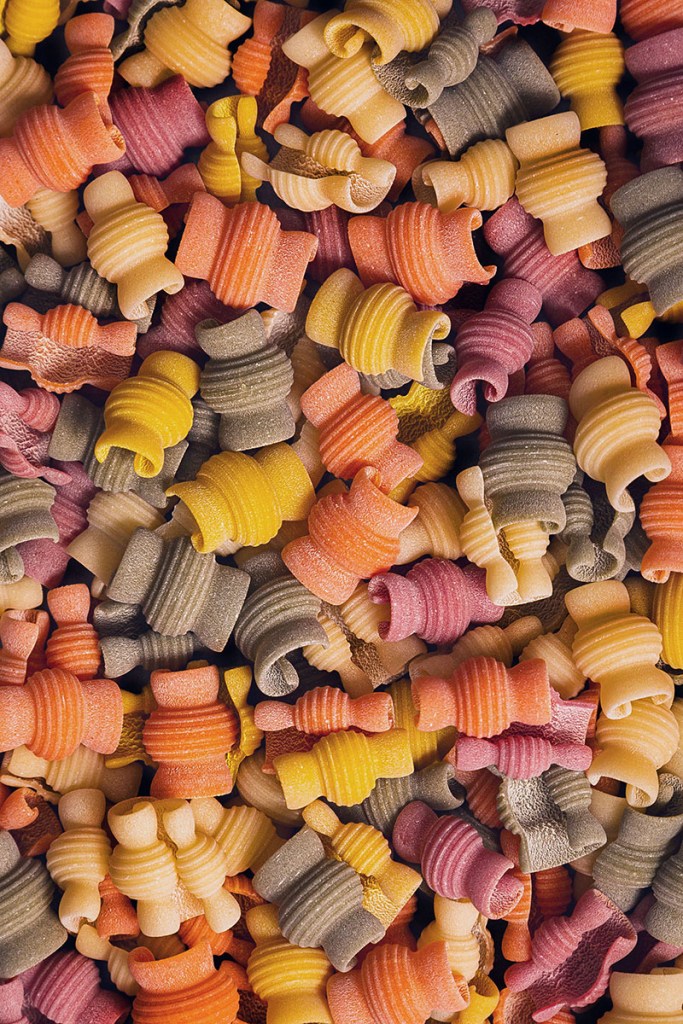 Multi-colour dry  pasta close up, micro. 