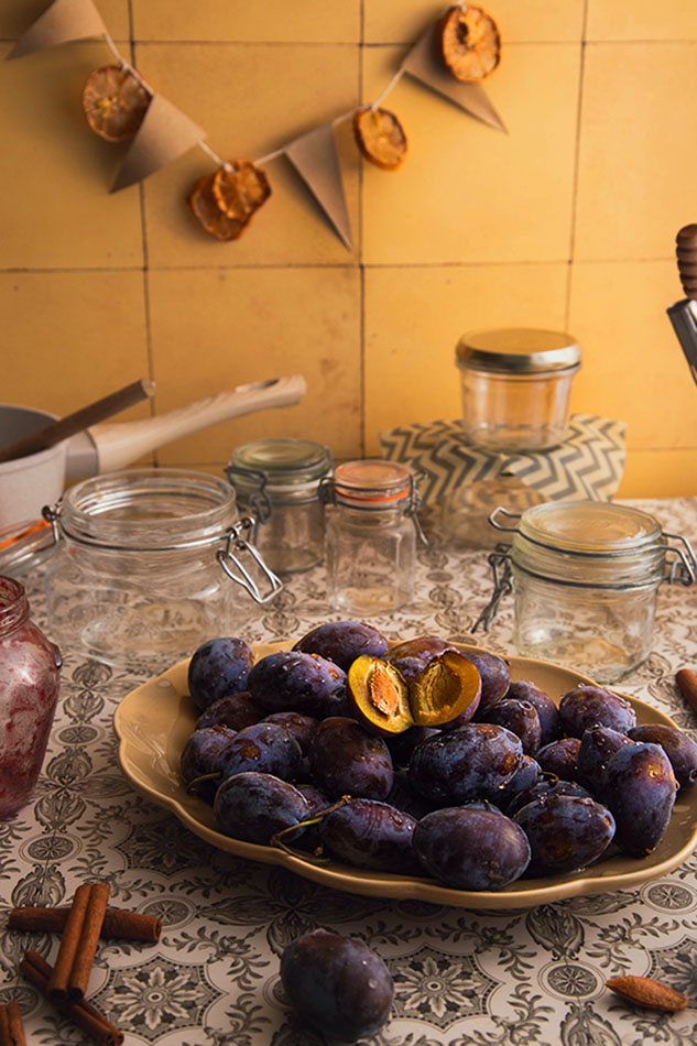Fresh damsons-Italian-plums-Stanley Prune Plums on a plate with empty jars ready for the jam. 