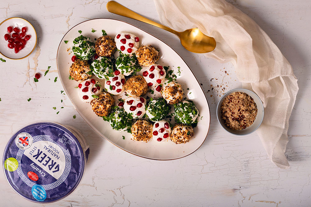 Labneh cheese balls rolled in dukkha, ground nuts, chopped parsley, and pomegranate
