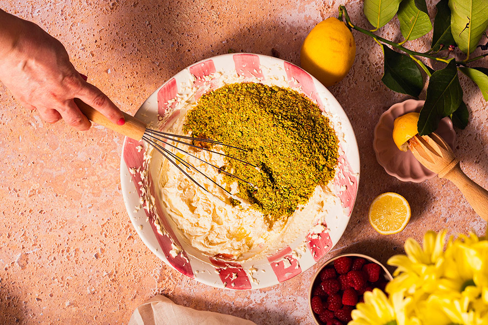 Mascarpone, double cream and ground pistachio praline cake mixture.