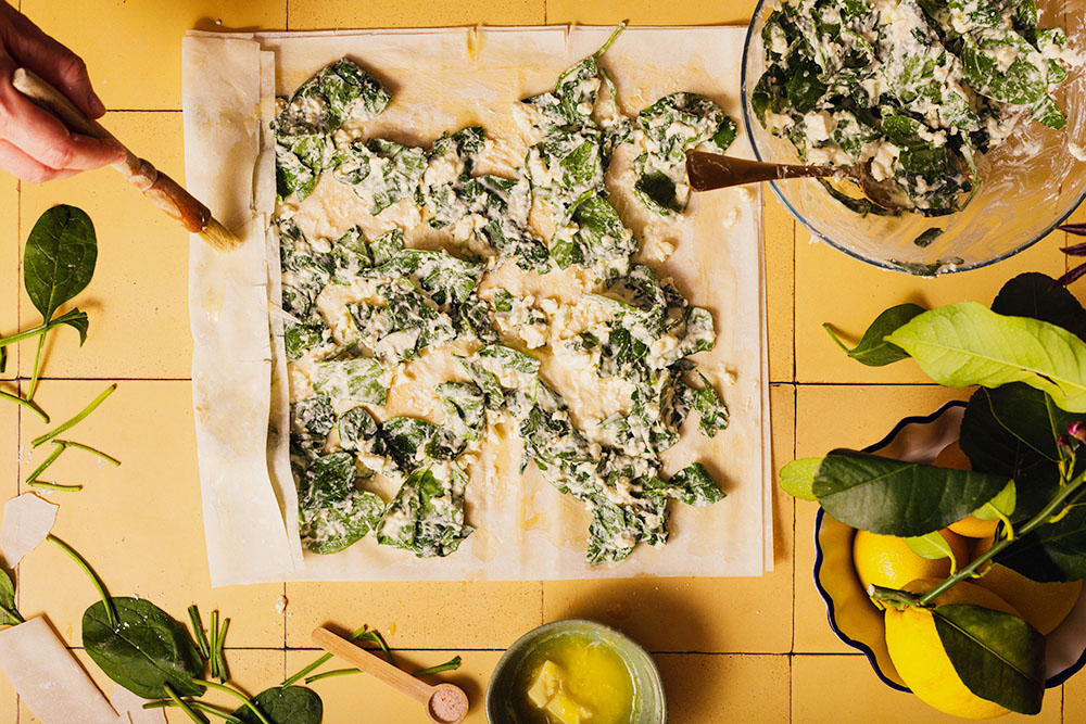 Spinach and feta cheese filo pie Balkan style with shop-bought filo pastry, process shot.