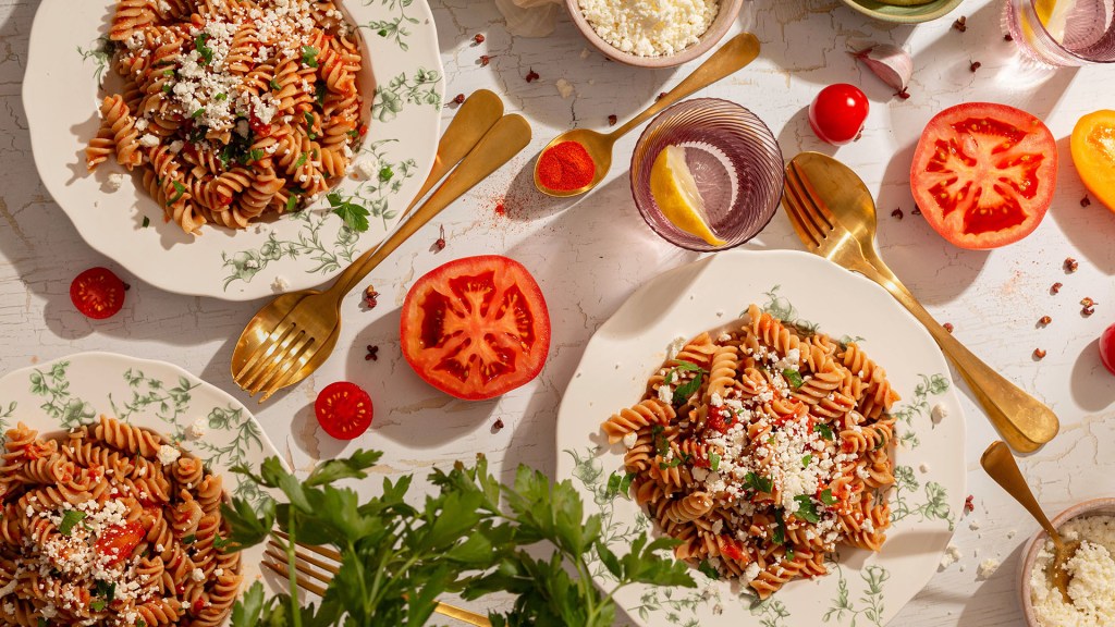 Healthy Fresh Tomato and Feta Cheese Pasta Sauce for Wholemeal Pasta served on the table.
