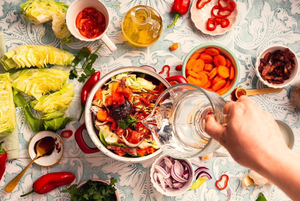Sweetheart Cabbage Stew with Summer Vegetables and crispy, fried pancetta- process shot.