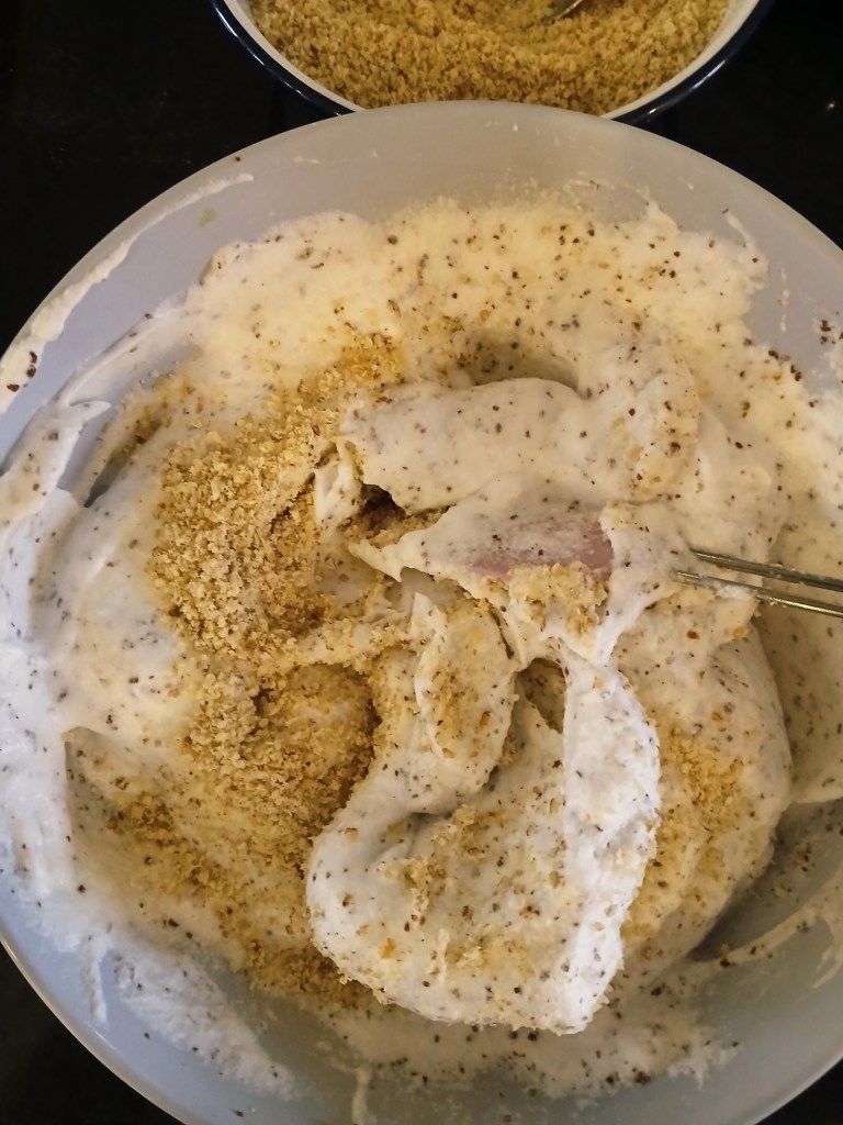 Torte of walnut dacquoise layered with vanilla and chocolate crème mousseline, whisked egg whites.