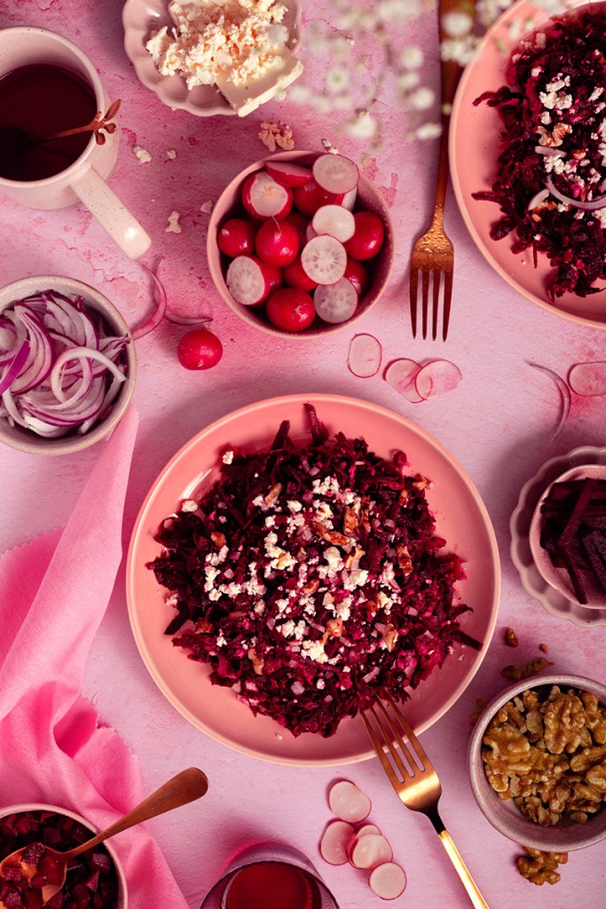Grated raw beetroot salad with feta cheese and chopped walnuts. 