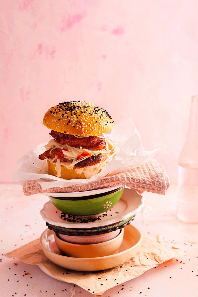 Ckicken burger in the bun with sesame seed spinkle. 