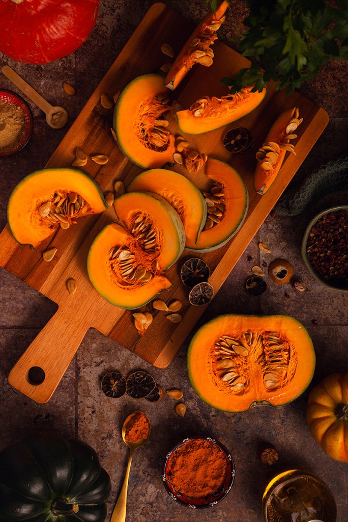 Sliced orange squash on the chopping board. 