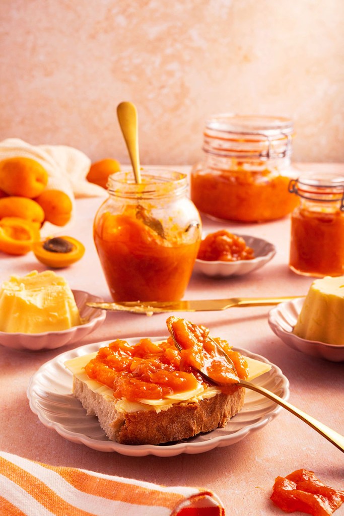 Homemade apricot jam on toast or freshly baked sourdough bread with some homemade butter.