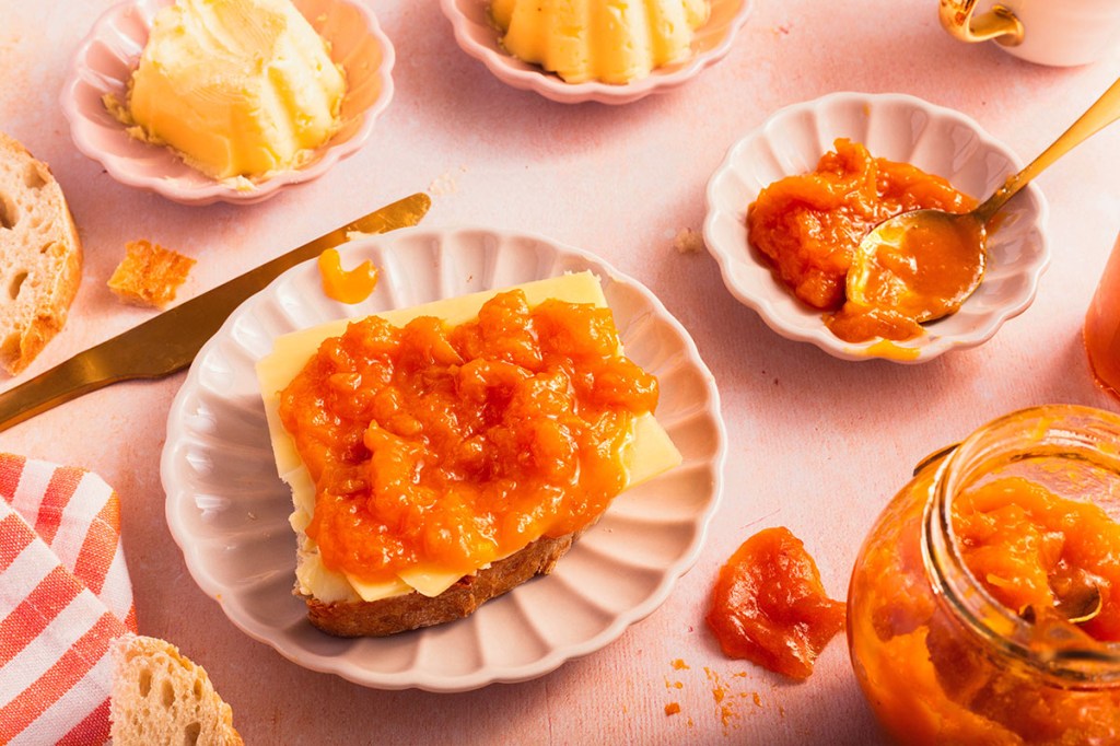 Apricot jam on sourdough bread with cheese and butter